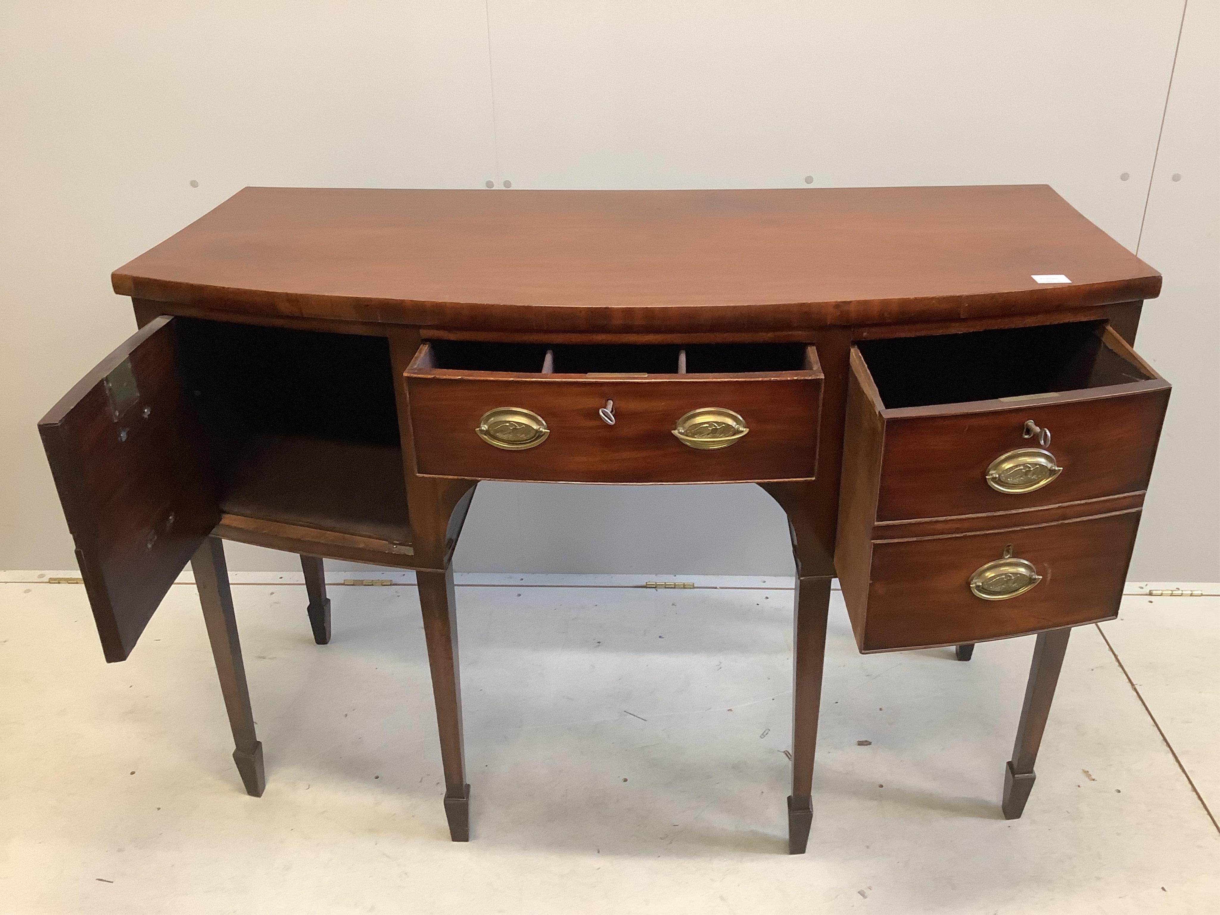 A George III mahogany bow front sideboard, width 136cm, depth 62cm, height 93cm. Condition - fair